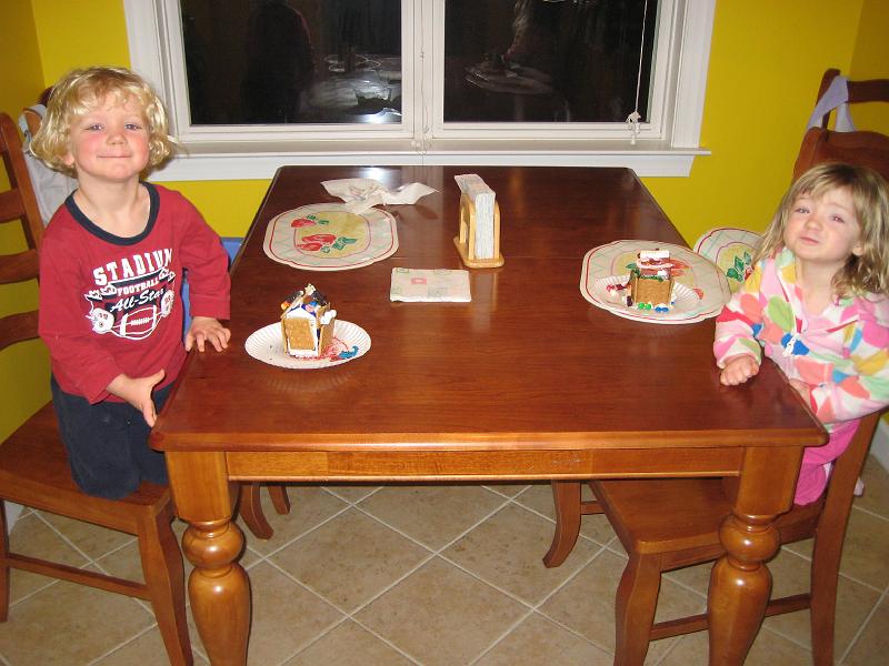 011.JPG - Elijah and Madeline with their gingerbread houses from daycare